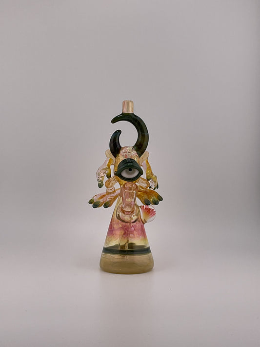 Fumed Jacob jarvis warrior mini tube front view, green horns flower marble pink and yellow hues large eyball with fingernails and toes